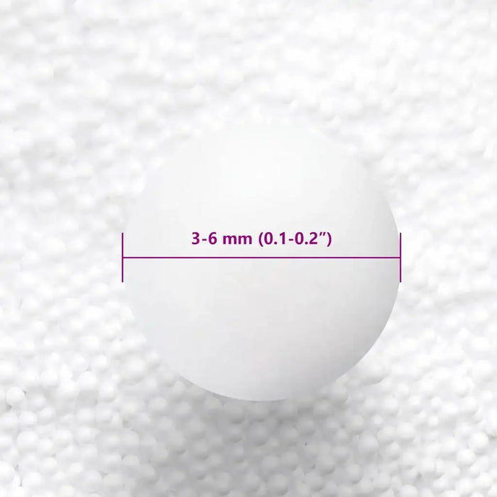 Close-up of a white foam ball with a 3-6 mm diameter label on a textured white foam background
