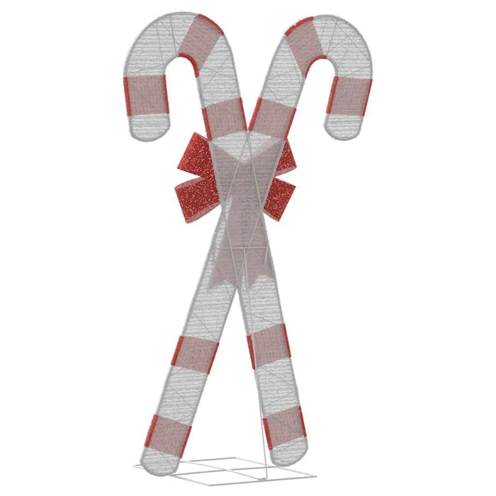 Large wireframe Christmas decoration of two crossed red and white candy canes with a red bow