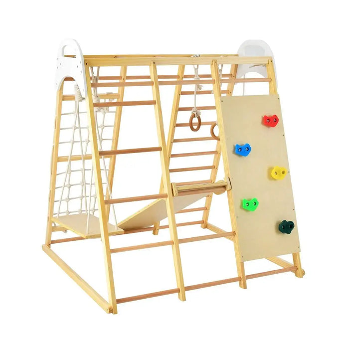 Children's wooden play gym with climbing wall, slide, and monkey bars on a white background