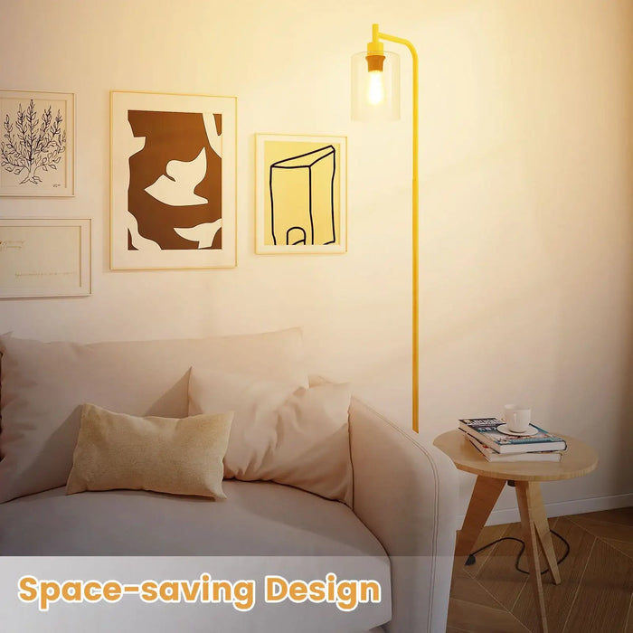 Modern living room with a yellow wall lamp, white sofa, and side table.