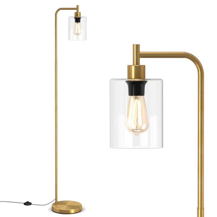 Modern floor lamp with gold finish and clear glass shade on a white background