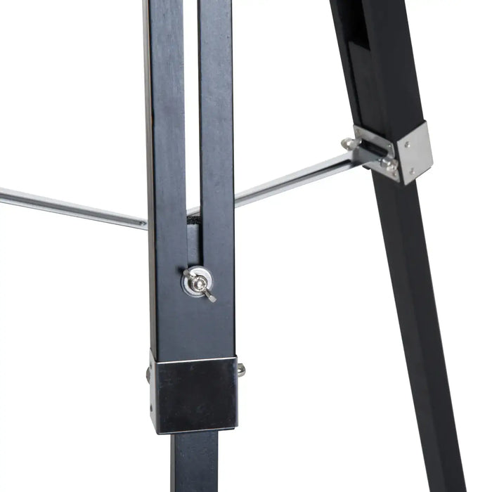 Close-up of a black metal stand with a white background