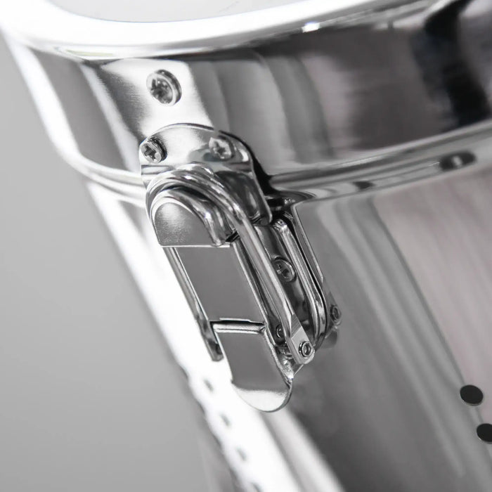 Close-up of a shiny metal hinge on a reflective surface