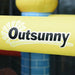 Close-up of Outsunny logo on yellow inflatable bouncy house material