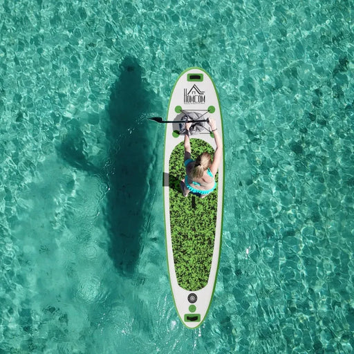 Woman paddling on inflatable paddleboard in clear turquoise water, HOMCOM logo visible