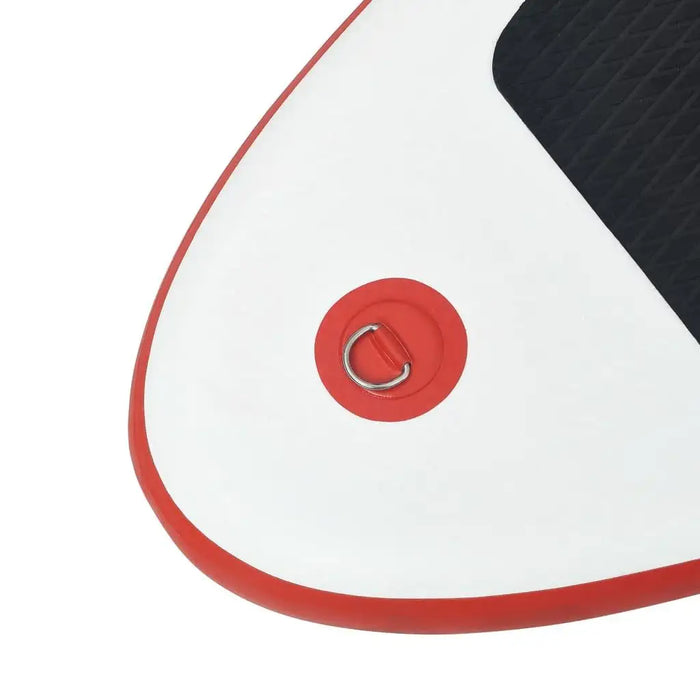 Close-up of red and white inflatable SUP board corner with black EVA pad and metal D-ring