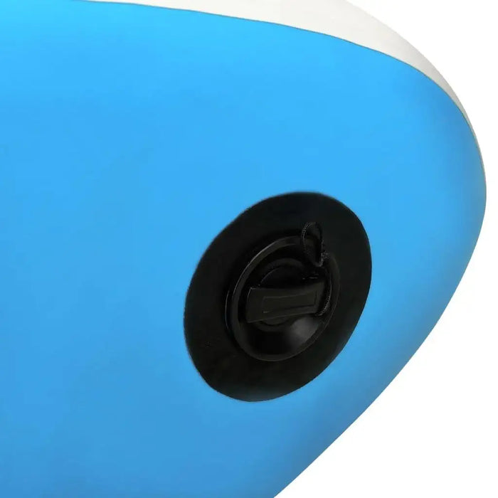Close-up of blue inflatable SUP board kayak valve with black cap