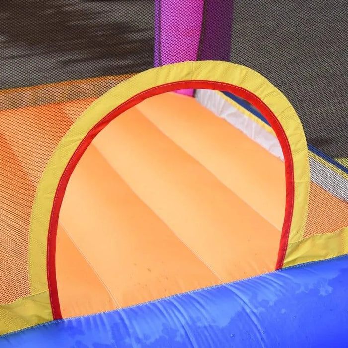 Inflatable water park with orange slide, yellow arch, and blue pool section
