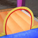 Inflatable water park with orange slide, yellow arch, and blue pool section