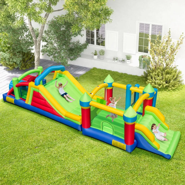 Colorful inflatable obstacle course with children sliding and bouncing on green lawn in backyard