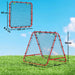 Red rebounder net with black mesh measuring 100x99x8.5 cm set on grass under blue sky
