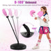 Child in pink boxing gloves punching pink and white rebound punching bag with flexible spring stand