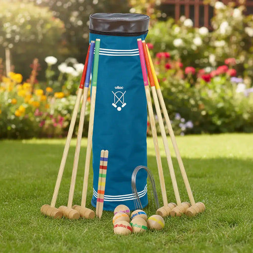 Vilac wooden junior croquet set with six colorful mallets, balls, wickets, and blue storage bag on garden lawn