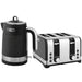 Black and silver electric kettle and toaster on a white background