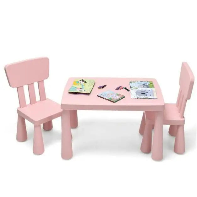 Pink kids activity table and two chairs set with books and crayons on top