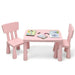 Pink kids activity table and two chairs set with books and crayons on top