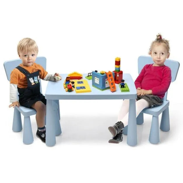 Kids sitting at blue activity table with chairs, building blocks on tabletop, white background