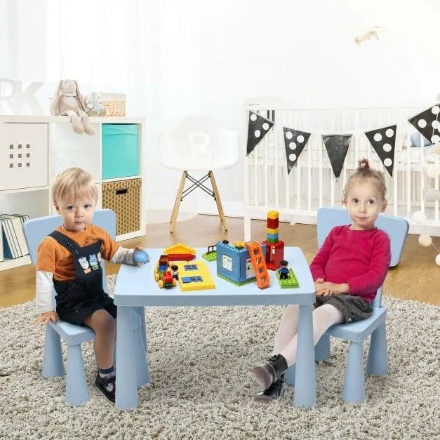 Kids activity table and two chairs set in blue with children playing in a nursery room