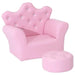 Pink kids armchair with crown-shaped backrest, crystal buttons, and matching footstool