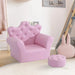 Pink kids armchair with crown backrest, crystal buttons, and matching footstool in playroom