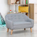 Kids grey linen-look armchair two-seater sofa with wooden legs in a playroom
