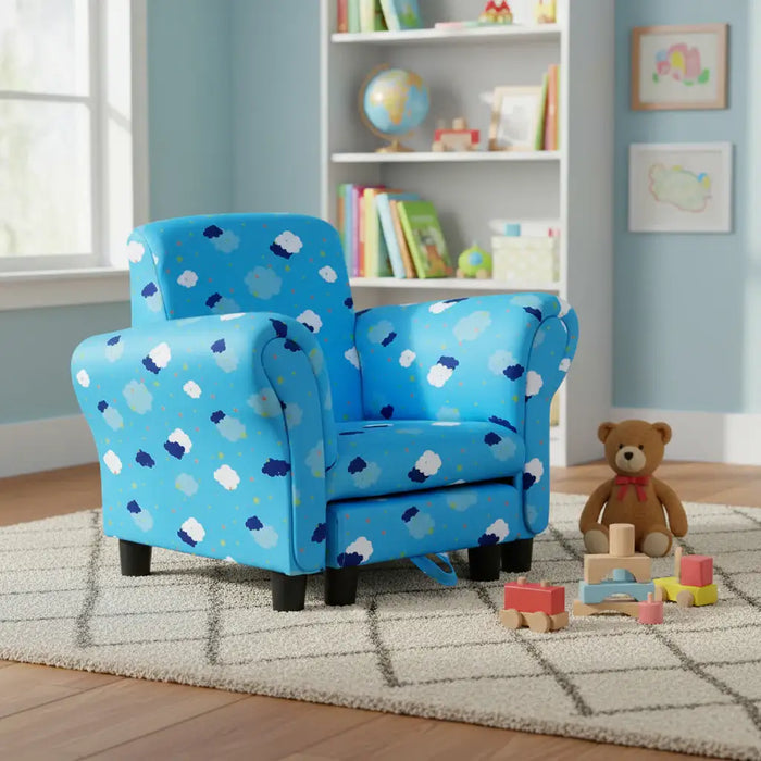 Blue kids armchair with cloud pattern in playroom, teddy bear and wooden blocks on rug