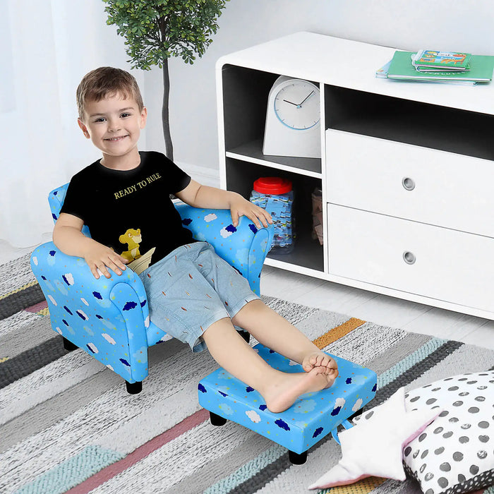 Smiling boy sitting on blue kids armchair with footrest in a modern playroom