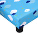 Blue kids' bed corner with cloud and star pattern, black plastic leg visible