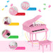 Kids pink 30-key grand piano with matching bench, music stand, and colorful labeled features
