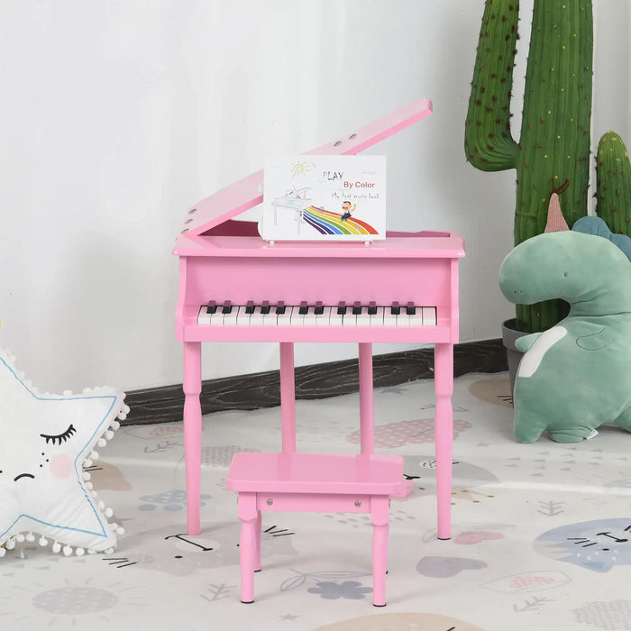 Kids baby pink miniature grand piano with matching bench in playroom, plush toys, and music book