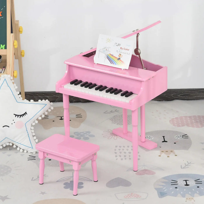 Kids pink 30-key miniature grand piano with matching bench in a playroom setting