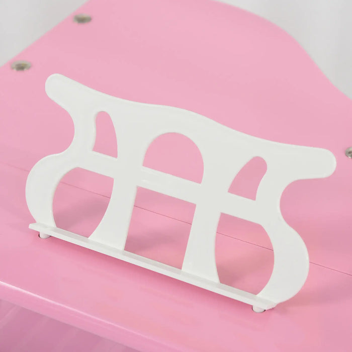 Close-up of white music stand on pink kids baby grand piano