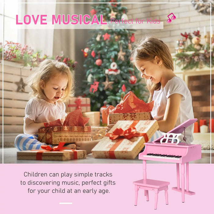 Kids opening presents by Christmas tree with pink toy piano and matching bench