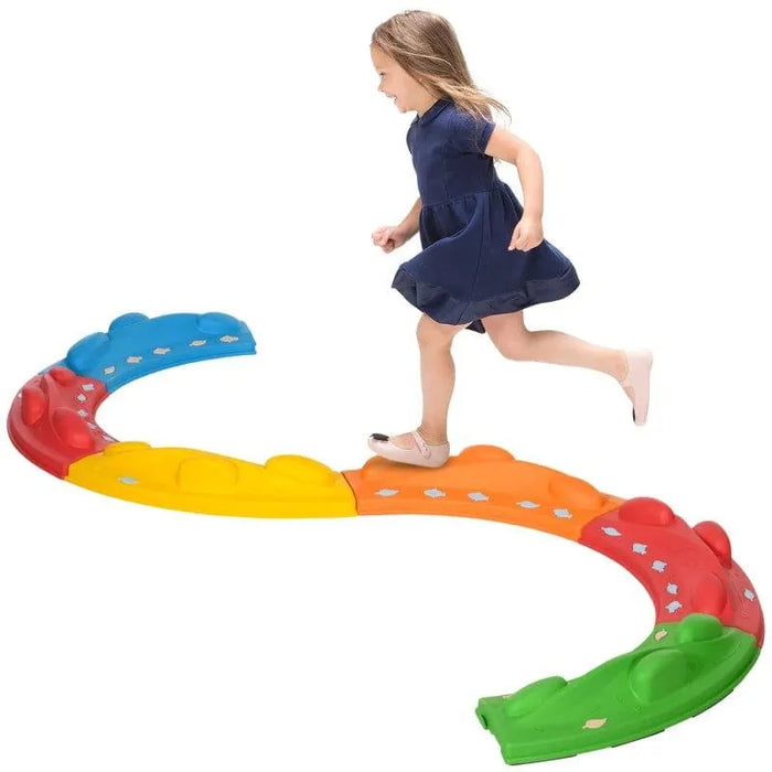 Child playing on colorful modular kids balance beam set for indoor activity
