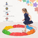 Child balancing on colorful modular balance beam set, ideal for kids aged 3-8 years old.
