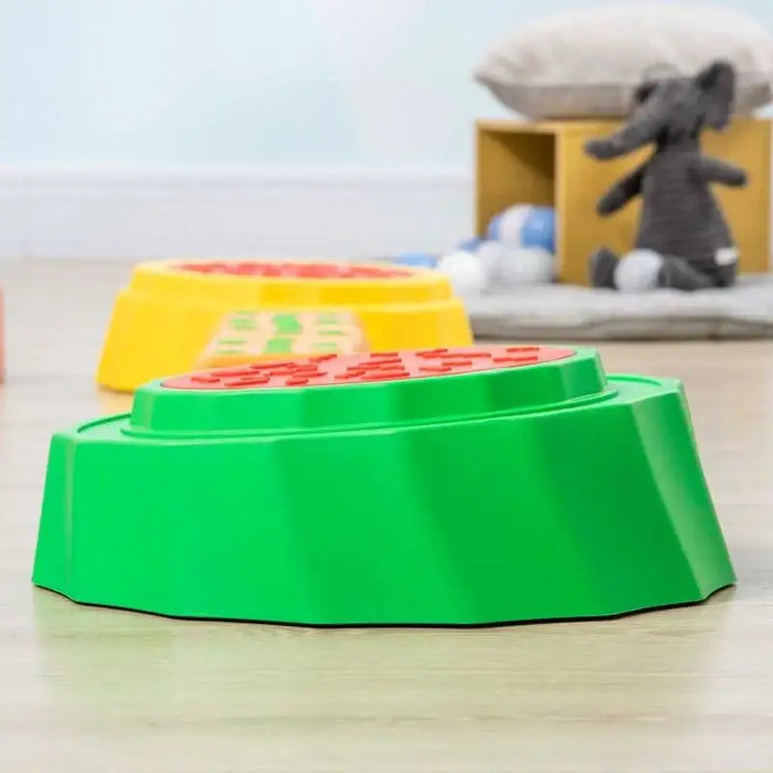 Kids balance beams and stepping stones set with green and yellow textured pieces in playroom