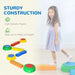 Girl walking on colorful kids balance beams and stepping stones set indoors, sturdy construction