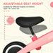 Pink kids' balance bike with adjustable seat height 31-35cm shown for ages 1.5-3 years.