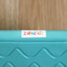 Close-up of Zonekiz blue kids balance board with textured surface on wood floor