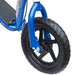 Close-up of blue kids big wheel scooter with wide deck and 12-inch black front tire