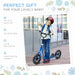 Child wearing helmet riding blue big wheel kids scooter with adjustable height outdoors