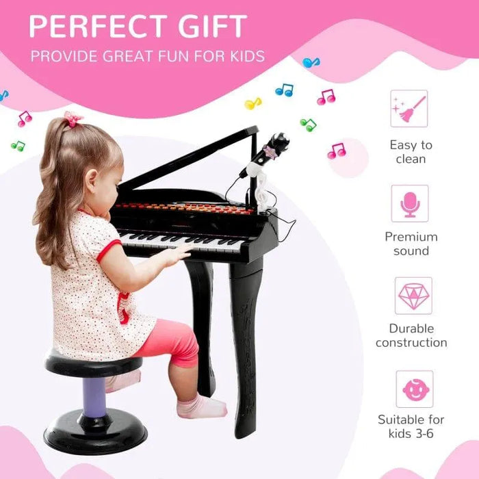 Young girl playing black 37-key mini grand kids piano with stool and microphone, gift idea
