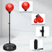 Red punching ball with black adjustable stand, boxing gloves, and durable spring base