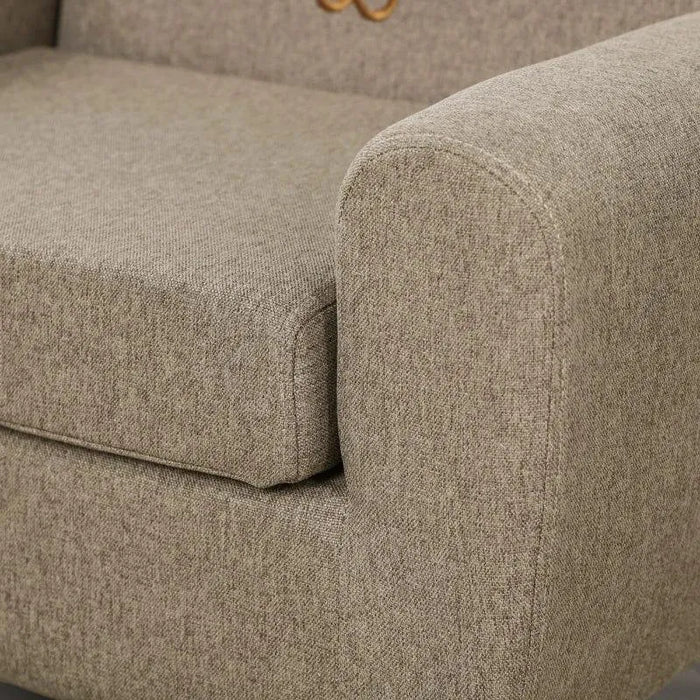 Close-up of brown kids chair with armrest and ear-shaped backrest detail, fabric upholstery