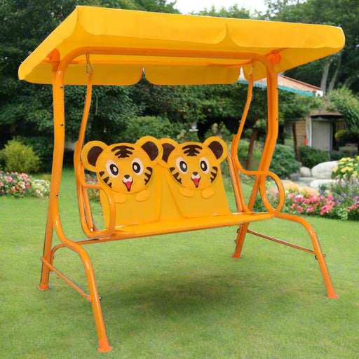 Kids cheetah design swing seat with yellow canopy on garden patio lawn