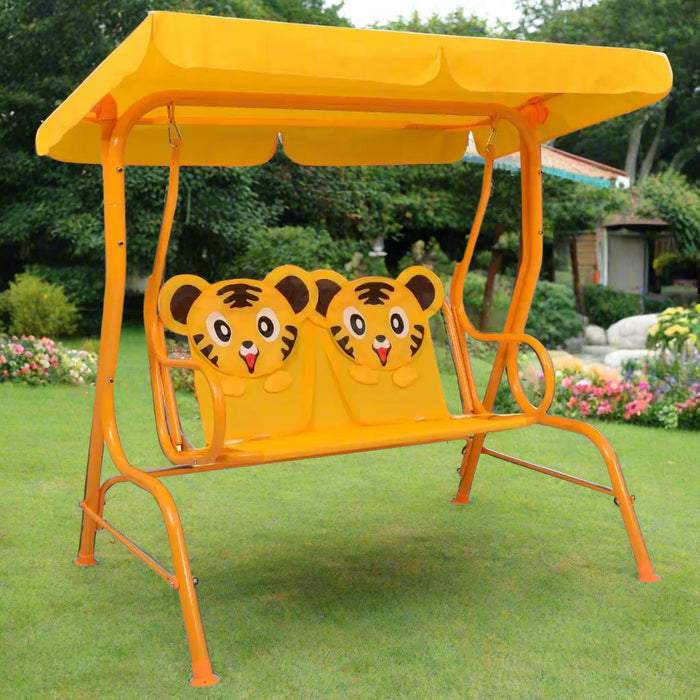 Kids cheetah design swing seat with yellow canopy on garden patio lawn
