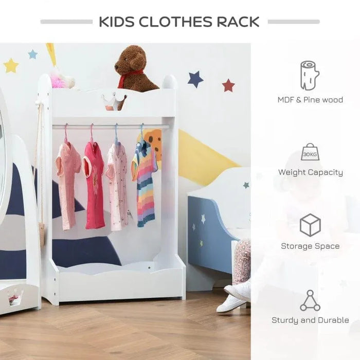 White kids clothes rack with crown design, hanging dresses, and plush toys in a colorful nursery