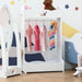 White kids clothes rack with crown design, pine wood, colorful clothes hanging in playroom