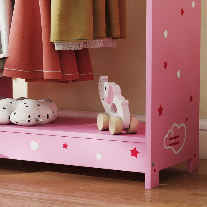 Pink kids clothes rack with cute star and heart decals, wooden elephant toy on bottom shelf