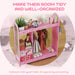 Pink kids clothes rail and storage shelf with dresses, toys, books, and a full-length mirror for organized children's room